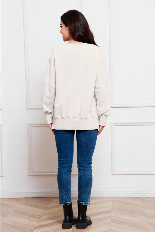 Exposed Seam Long Sleeve Slit Sweatshirt